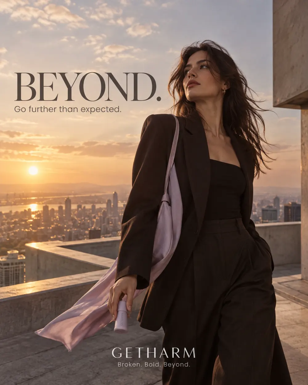 GETHARM campaign image: model in a black suit on a rooftop at sunset, lavender bag in hand